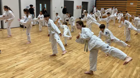 BBC/TOM WILLIAMS Picture of Cambridge Taekwon-Do members, young and old, since becoming established in 2015