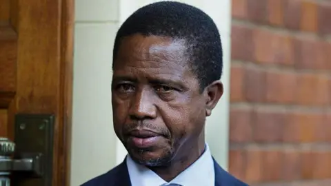 A close-up of Edgar Lungu wearing a suit 