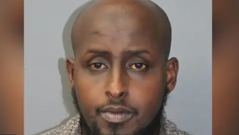 Metropolitan Police Mohamed Iidow, a black man with facial hair