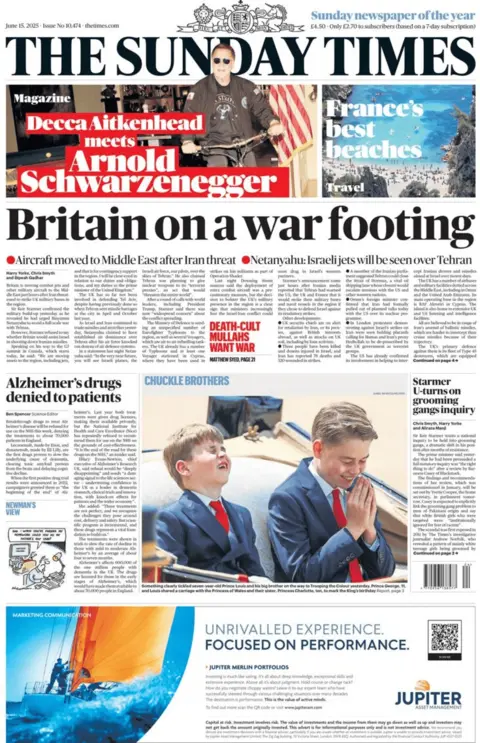 The front page of the Sunday Times. The headline reads "Britain on a war footing". Elsewhere is an image of Prince George and Prince Louis, laughing in a carriage during Trooping of the Colour. A caption reads "Chuckle Brothers".