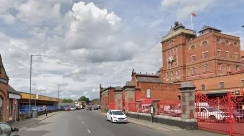 Streetview image of Radford Road in Nottingham with a white car on the right hand side of the photo
