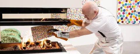 Getty Images Damien Hirst burning his own artworks