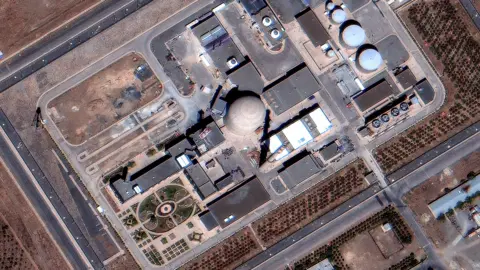 Maxar Technologies/Getty A satellite image shows the Arak heavy water reactor building before it was hit by air strikes