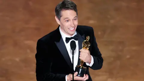 Getty Images Sean Baker at the 97th Oscars held at the Dolby Theatre on March 2, 2025 in Hollywood, California.