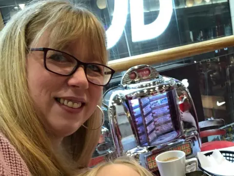 Claire A picture of Claire at a restaurant