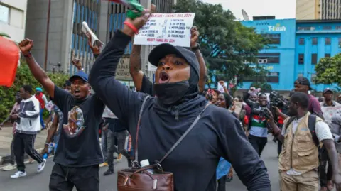 Gerald Anderson/Getty Images  People gather to stage a demonstration against the Financial Bill for 2024 and tax increases as they march towards the parliament building in Nairobi, Kenya on 18 June.