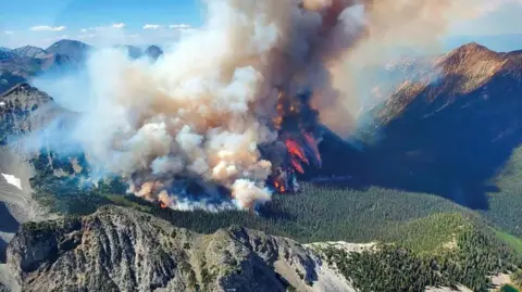 BC Wildfire Service/Reuters Smoke rises from the Texas Creek wildfire (K71415) south of Lillooet, British Columbia, Canada July 9, 2023. 