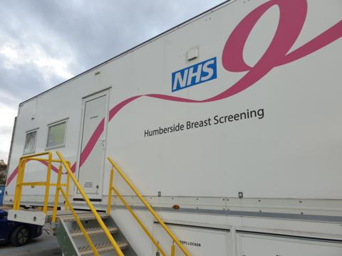 A large mobile unit with 'NHS Humberside Breast Screening' written on the side