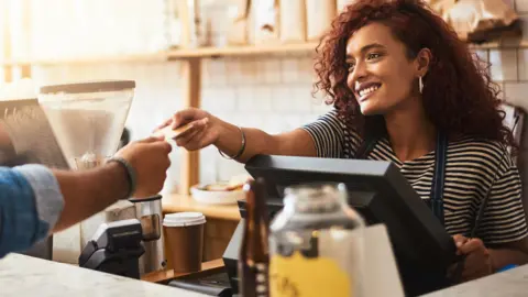 Getty Images Waitress in a coffee shop