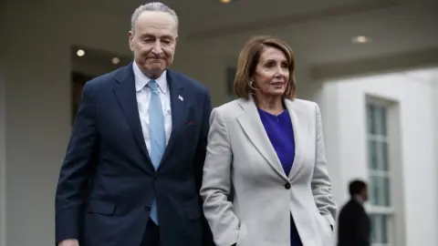 EPA Speaker of the House Nancy Pelosi (R) and Senate Minority Leader Chuck Schumer (L) walk out of the West Wing,