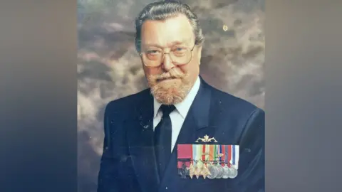 A formal portrait of Petty Officer Thomas Gould shows an older man wearing a Royal Navy uniform with medals, standing against a neutral studio background.