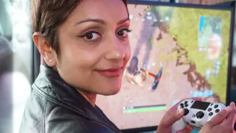 BBC/Chris Foxx Perveen Akhtar playing Fortnite