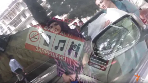 Radioi Ozodi/YouTube Tajik taxis ban public shows of affection, October 2019