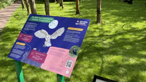 Dorothy House A board which has an image of an owl on it