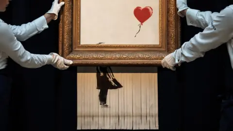 Getty Images Love is in the Bin by Banksy