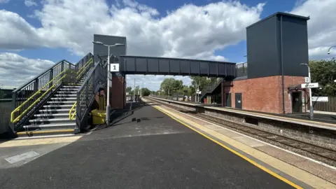 New steps, and two new lifts between a walkway at Alfreton railway station.