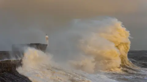 Getty Images Huge waves clang  into a constituent   and airy  location   connected  the Bristol transmission  astatine  Porthcawl