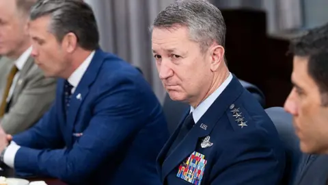 Getty Images Dan Caine, with grey hair wearing a military uniform with four stars on his epaulette