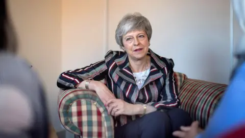 Reuters Theresa May at the Advance Charity offices in West London