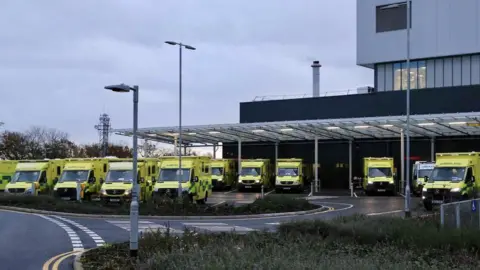 Getty Images Ambulances waiting to offload patients at the Grange Hospital in Cwmbran