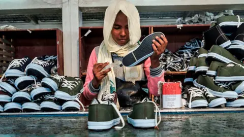 AFP A worker at an assembly line at a shoe factory in Ethiopia - 2019