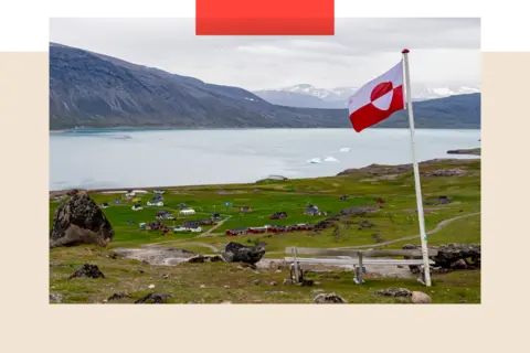 Getty Images A Greenland stands in the village of Igaliku, Greenland.