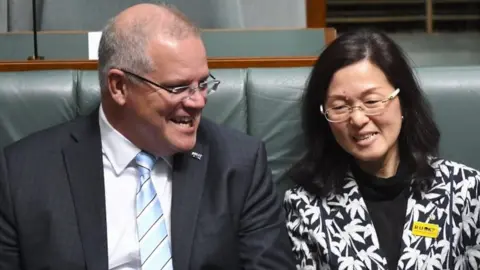 EPA Scott Morrison and Gladys Liu sit in parliament
