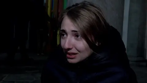 Survivor in tears speaks to camera