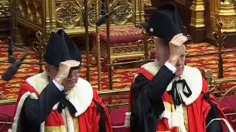 Men wearing ceremonial hats in Lords