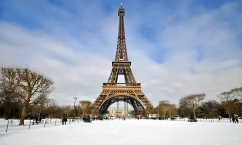 Getty Images Eiffel Tower with snow surrounding it