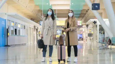 Getty Images Women at airport