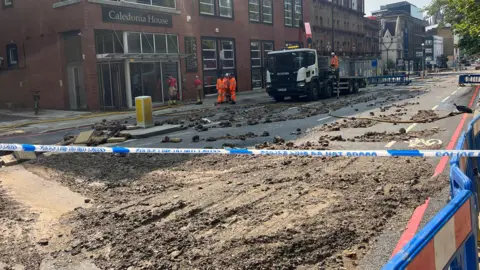 ANGIE GEORGE/BBC The clear-up operation on Pentonville Road on Sunday afternoon