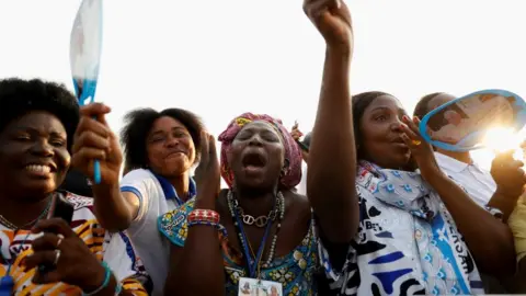 People gather as Pope Francis celebrates a mass during his apostolic journey, in Kinshasa