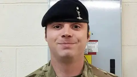 FAMILY HANDOUT L/Cpl Mongan wearing his army uniform and also a black hat
