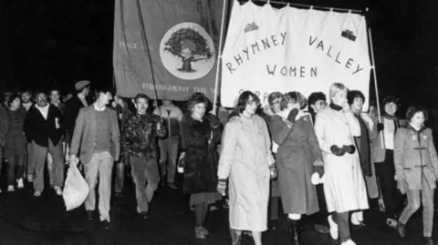 Michaela Hawkins Women leading a march with striking miners