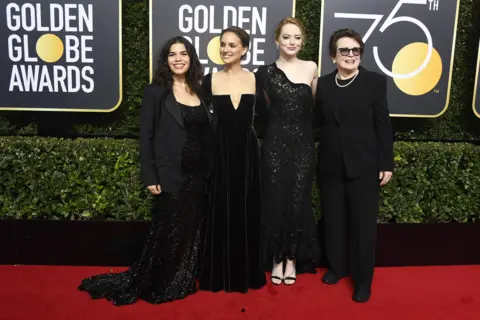 Getty Images Stars wearing back on the red carpet at the 75th Golden Globe Awards