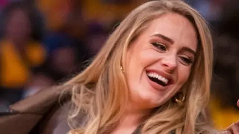 Getty Images Adele attends a game between the Golden State Warriors and the Los Angeles Lakers on October 19, 2021