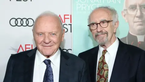 Getty Images Sir Anthony Hopkins and Sir Jonathan Pryce