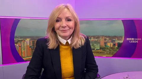 West Yorkshire Mayor Tracy Brabin, sitting in the BBC Radio Leeds studio, wearing a yellow top with a black jacket.