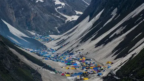 Getty Images Hindu pilgrims camping outside Amarnath caves