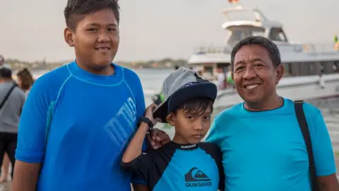 Nathalie Bertrams Mr Supriyatno with his children