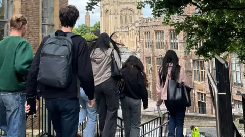 University of Bristol Students walking down steps with the Wills Memorial Building in the background