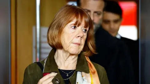 The French woman Gisèle Pelicot, the victim of the alleged rape of many people organized by her husband Dominique Pelicot in their home in the southern French town of Mazan, walks during a break in the case of Dominique Pelicot with 50 suspects, in the court of Avignon. , France, November 19, 2024