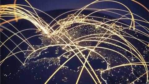 Getty Images World at night with abstract network lines