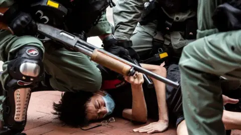 Pro-democracy protesters are arrested by police in the Causeway Bay district of Hong Kong on May 24, 2020, ahead of planned protests against a proposal to enact new security legislation in Hong Kong.