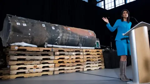 AFP US permanent representative to the UN Nikki Haley gestures towards the remnants of a ballistic missile fired at Riyadh in November