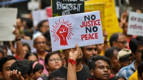 Students and citizens hold various posters during a rally in Kolkata, India, on September 1, 2024, demanding punishment for the accused involved in the rape and murder of a second-year PGT doctor at RG Kar Medical College, and also the resignation of the current Chief Minister and Health Minister Mamata Banerjee. (Photo by Debarchan Chatterjee/NurPhoto via Getty Images)
