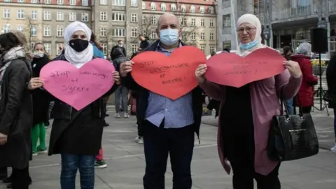 Mohammed Almalis Maya Almalis (Sara's sister), Awatif Zakaria (mother) and Ahmad Almalis (father) at a recent protest