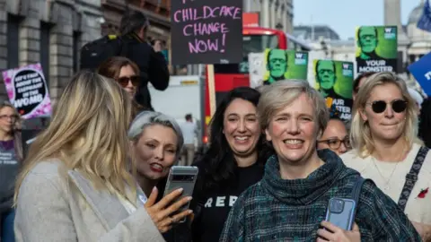 Getty Images MP Stella Creasy attends a protest for better childcare provision