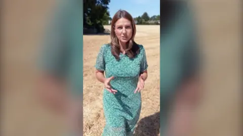 Correspondent Helena Wilkinson outside in dry field